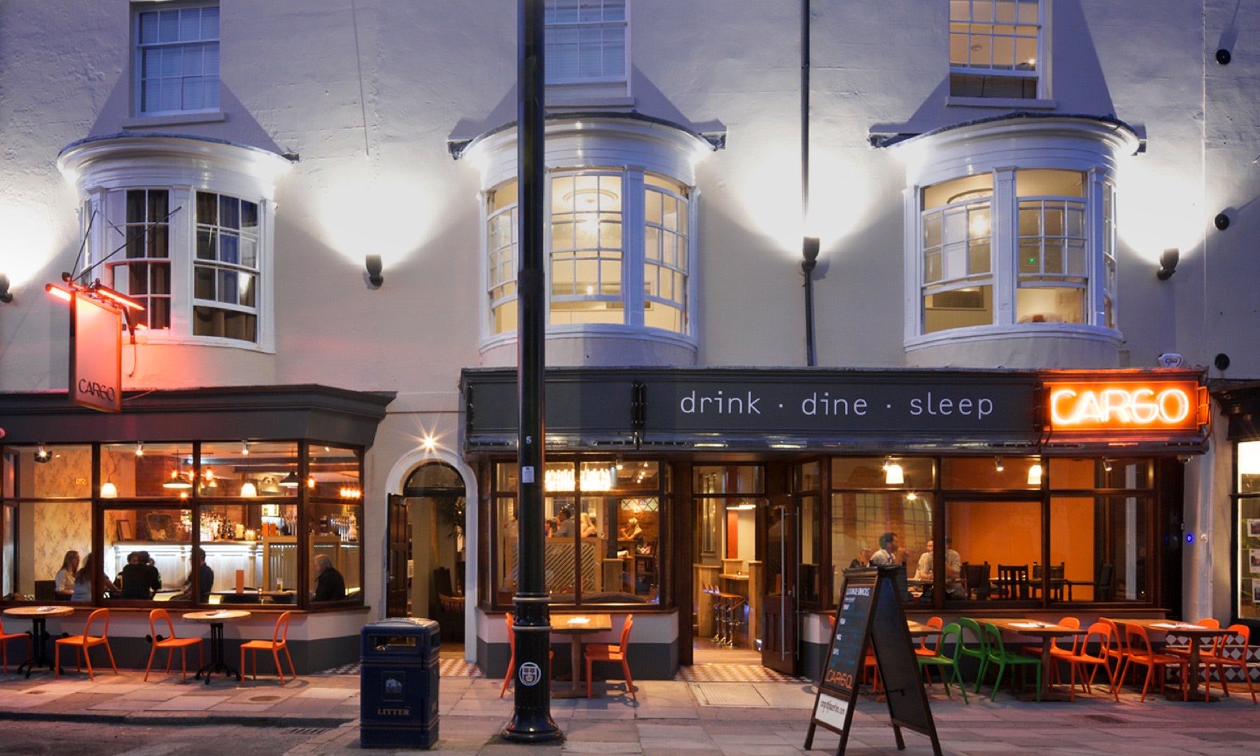 Cargo — guest rooms above a trading bar-restaurant, a working drink-dine-sleep building