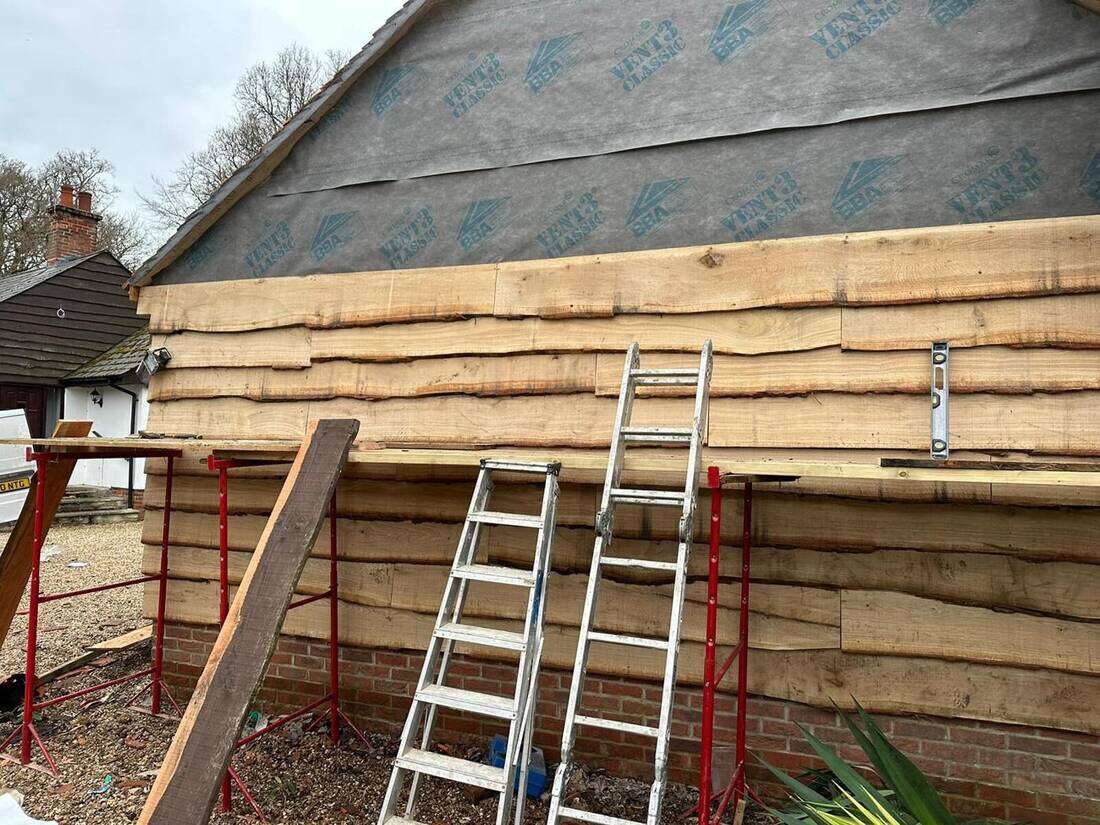 Waney-edge timber cladding, before