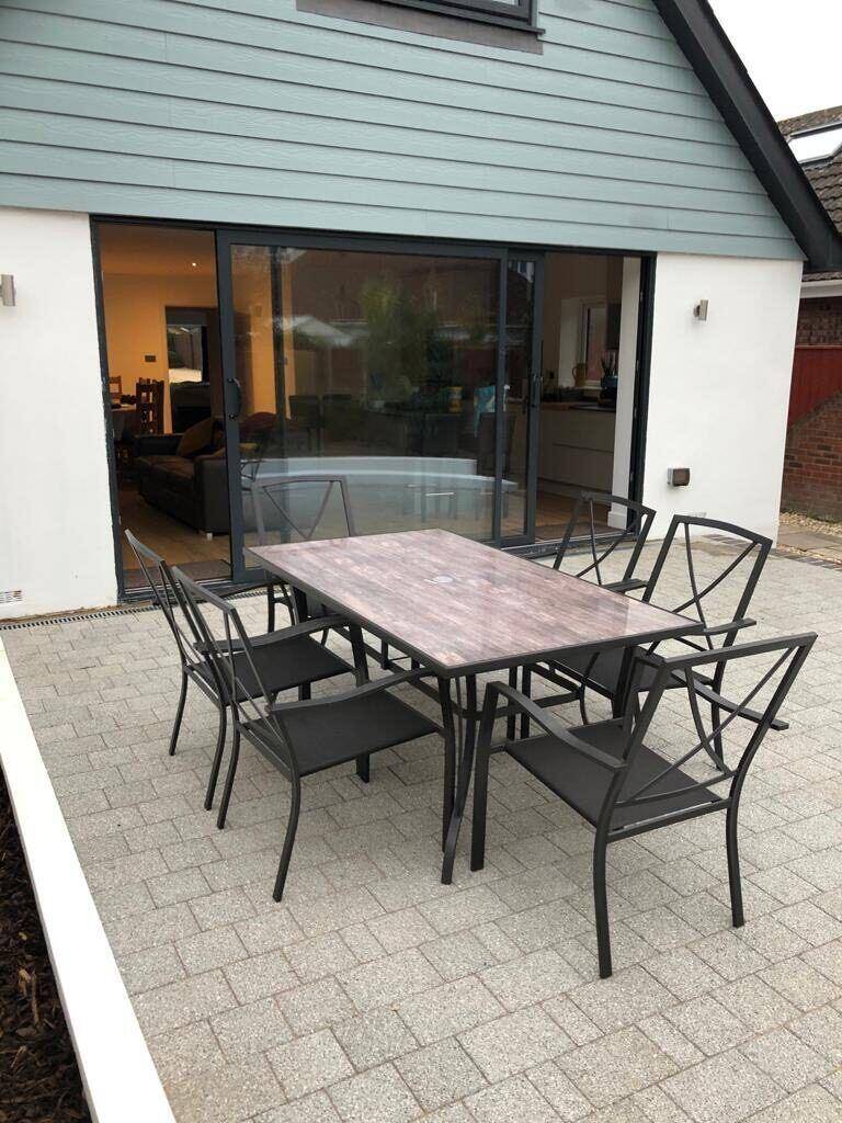 Glazed sliding doors opening to a patio