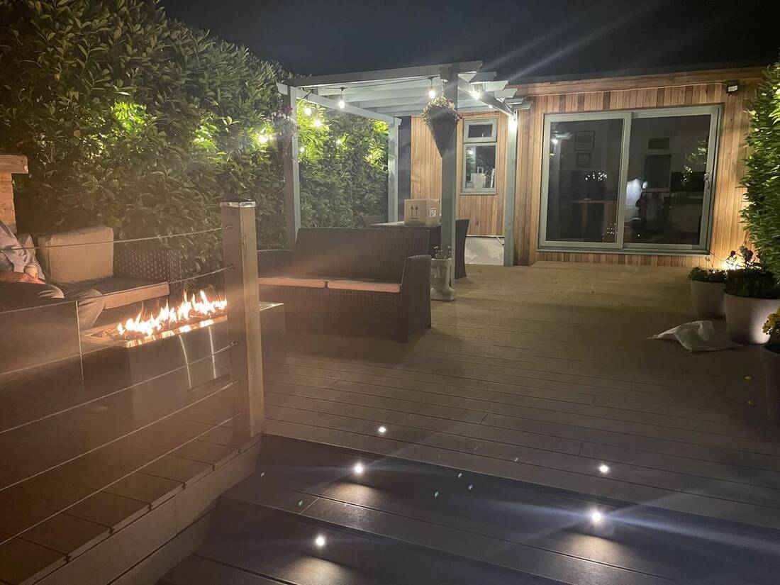 Garden room with deck lighting