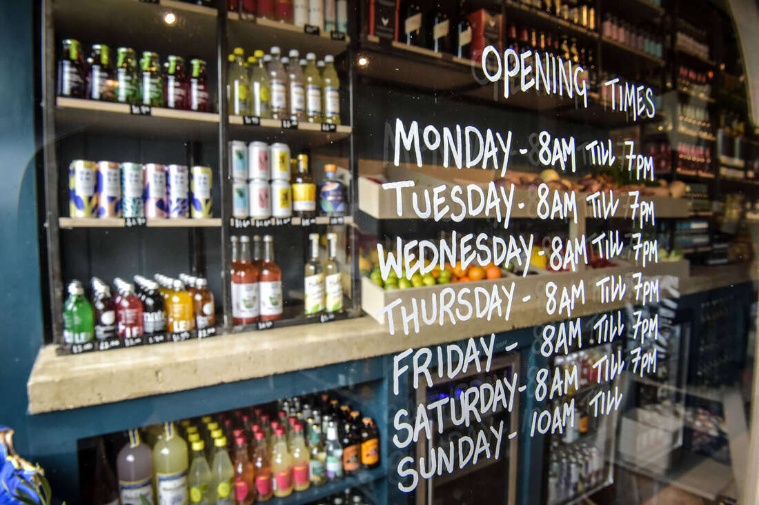 Chalkboard opening times and drinks shelving