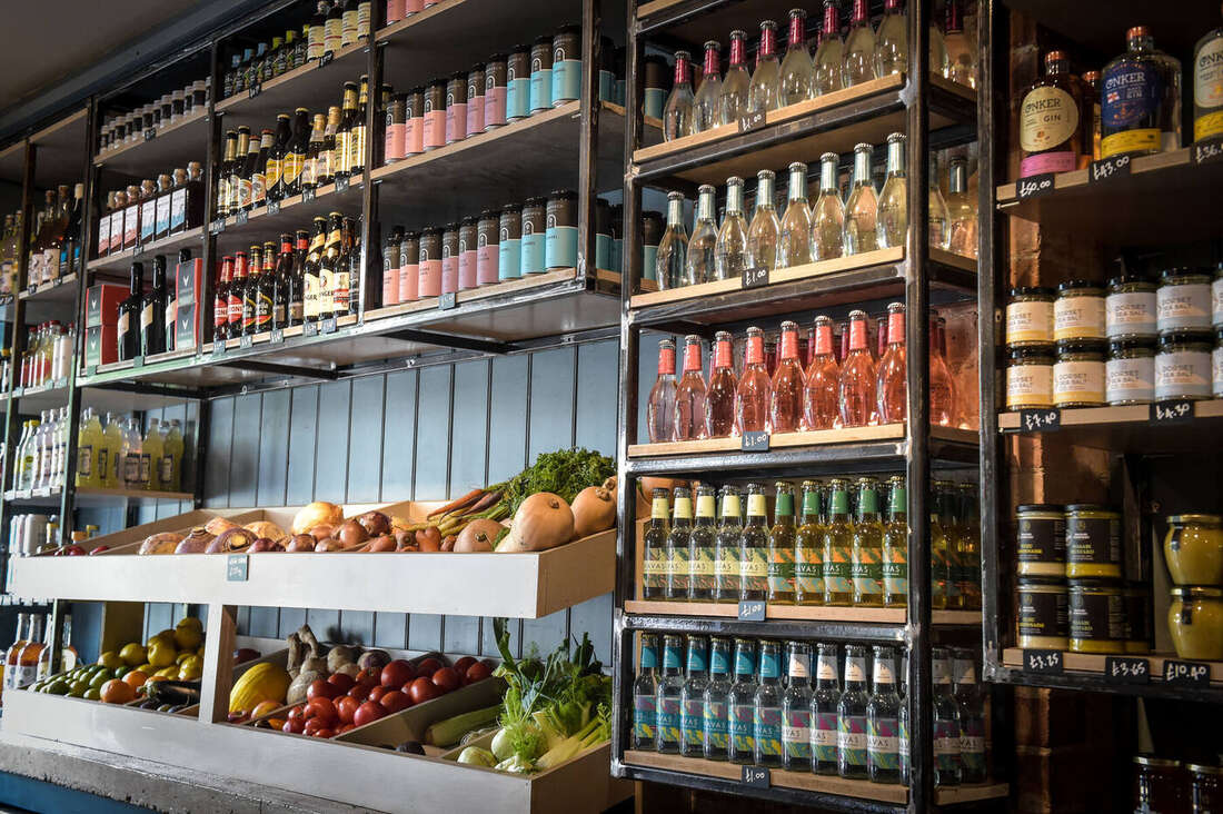Produce shelf and bottle wall