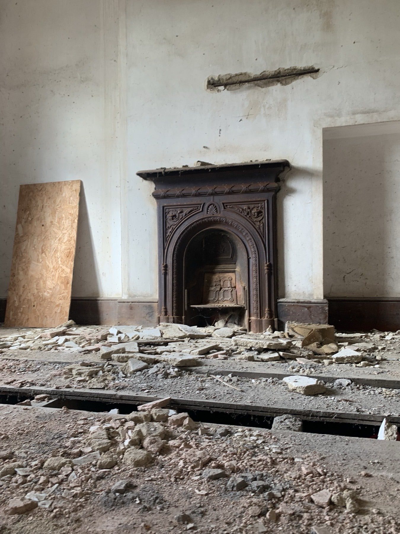 Original period fireplace in a building awaiting conversion